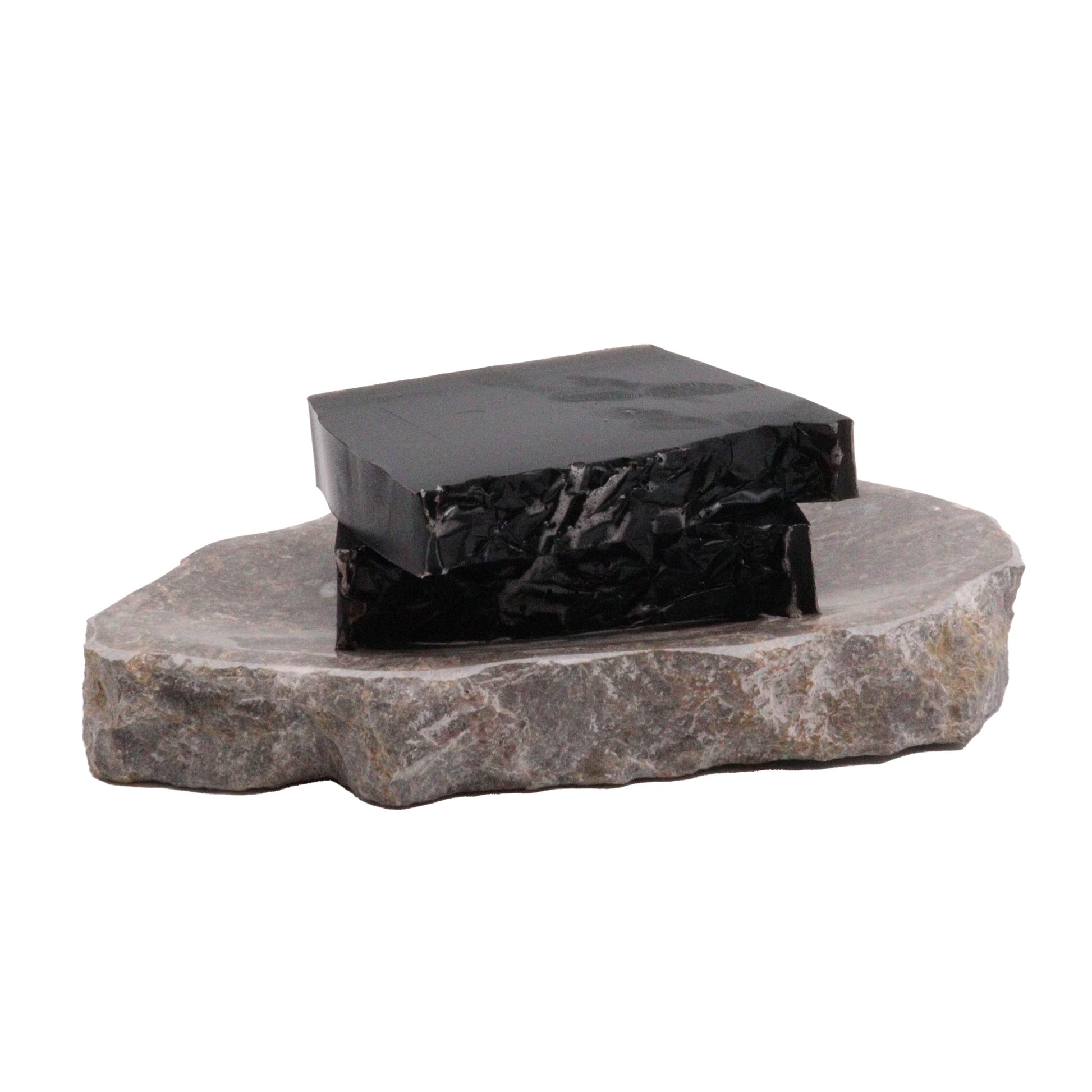 Hand-crafted dark soap bar with a natural texture and artisanal finish.