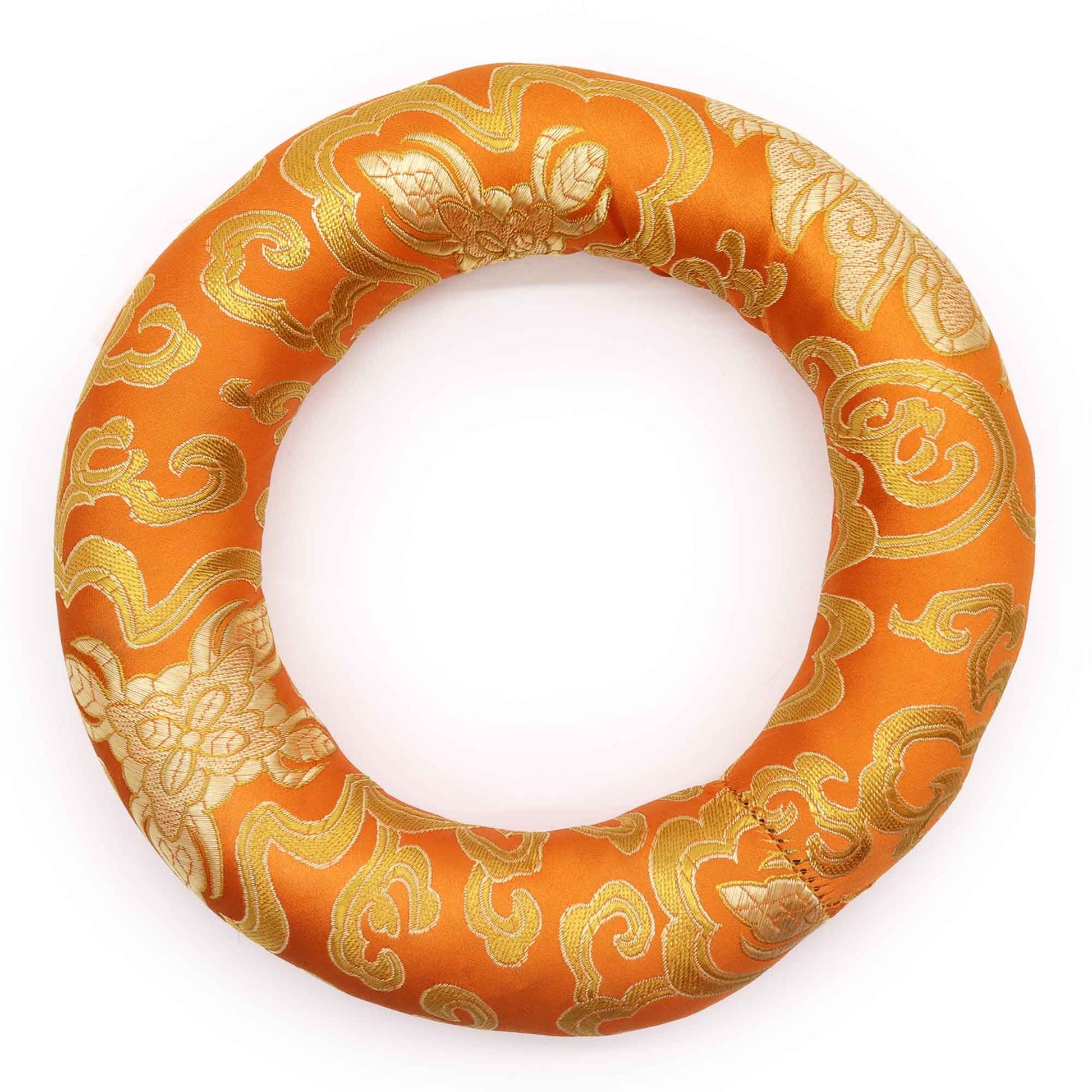 Circular fabric hoop cushion for supporting meditation singing bowls, featuring colourful patterns and embroidery.