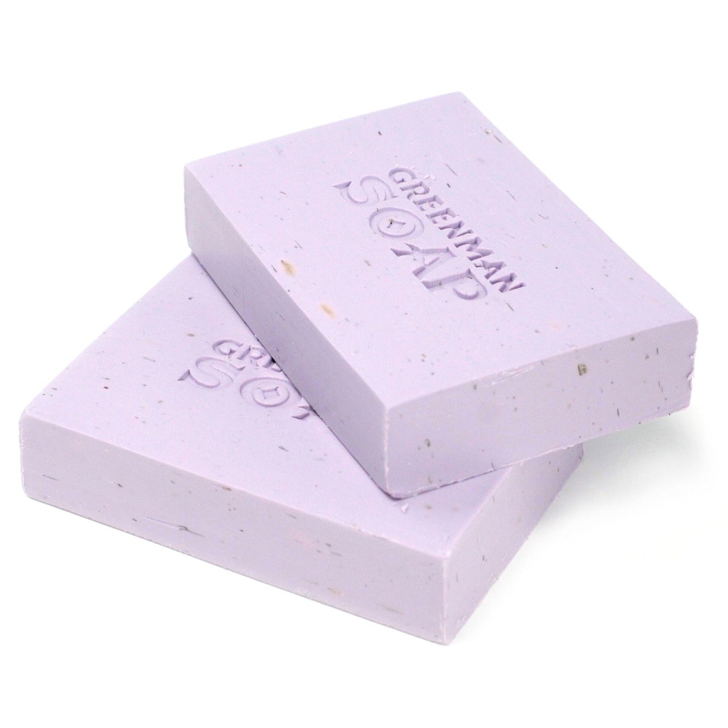 Handcrafted purple soap bar topped with dried lavender flowers and botanical textures.