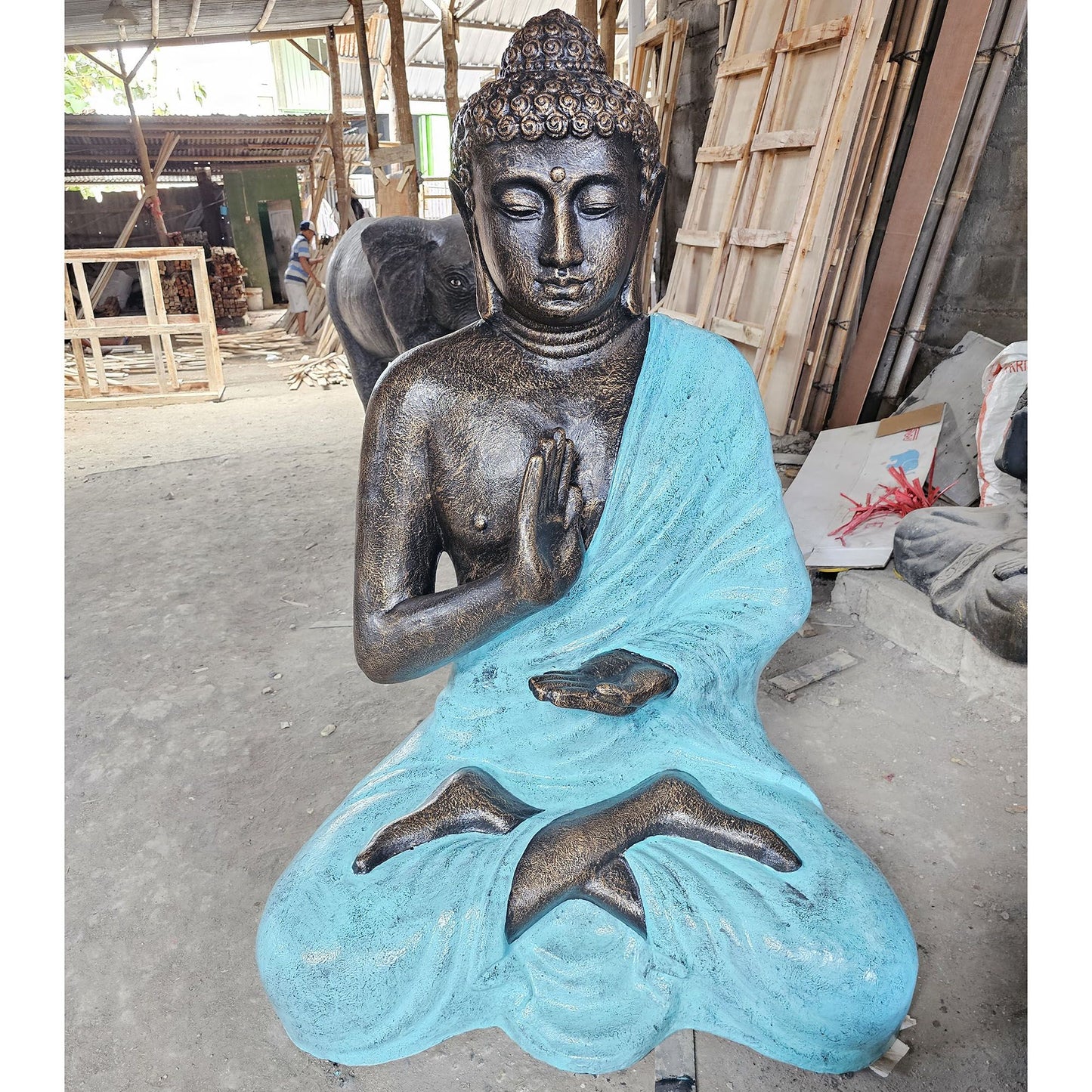 Large turquoise and stone Buddha statue in a meditative pose set within a traditional stupa structure, standing 1.5m tall.