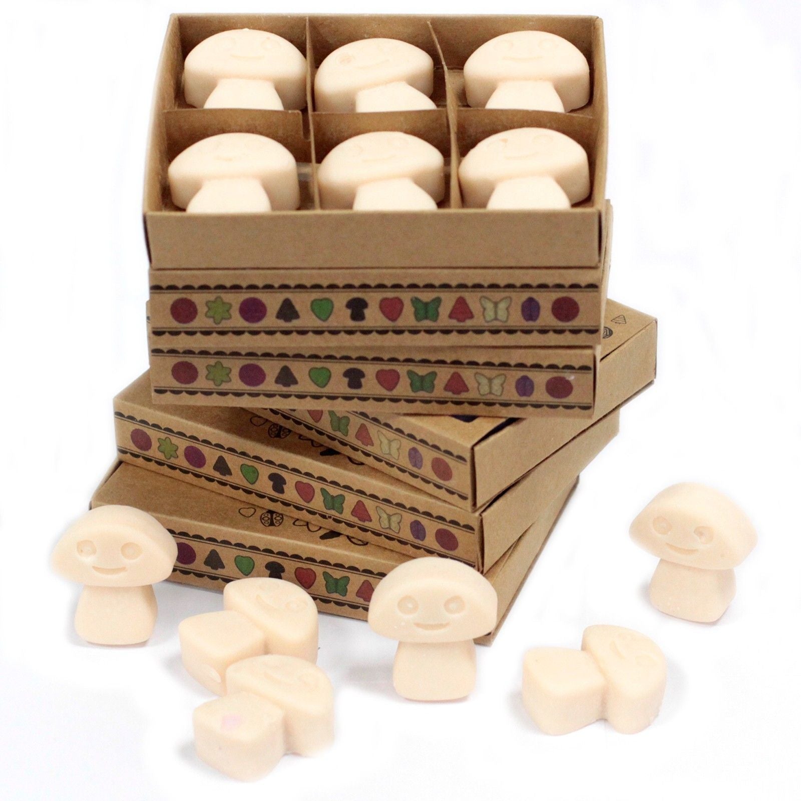 Six star-shaped vanilla and nutmeg scented natural soy wax melts in a small matchbox-style cardboard box.