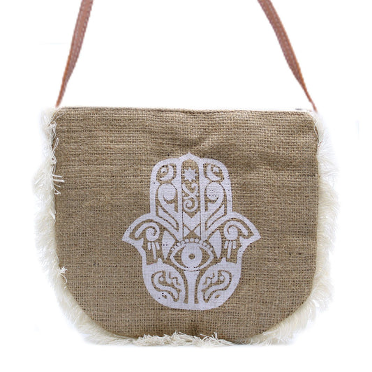 Soft washed natural jute bag featuring a black Hamsa hand screen print and decorative cotton fringe border.