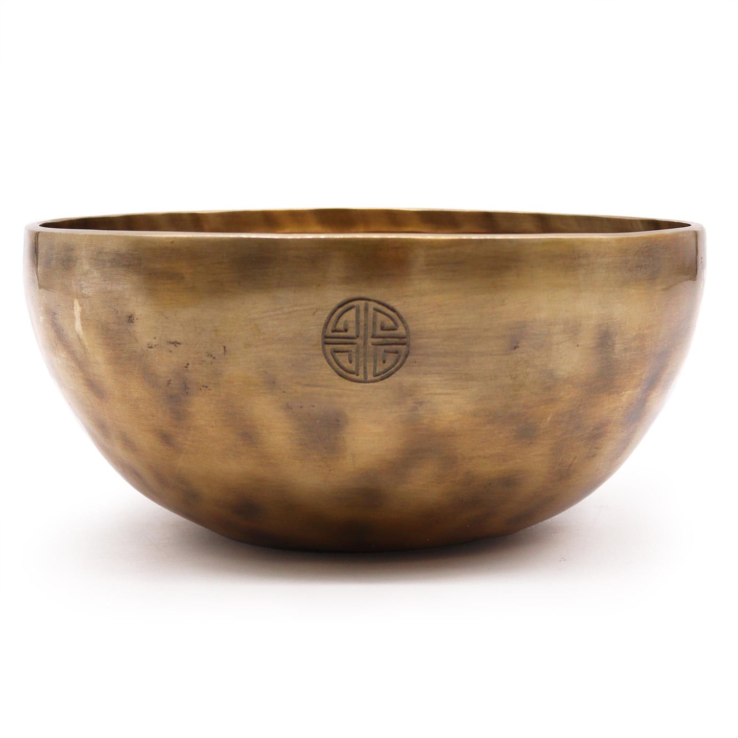 A large, hand-hammered metallic singing bowl with a traditional matte finish, showing authentic artisanal textures.
