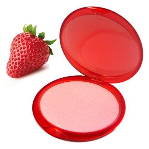 Small round container of pink strawberry scented paper soap sheets on a plain background.