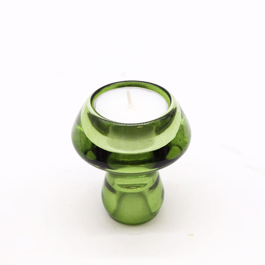 Translucent garden jade green glass mushroom-shaped holder designed for both dinner candles and tealights.