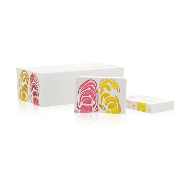 Large artisanal handcrafted soap loaf with a beautiful floral design and rich textures, featuring orchid-inspired colours.