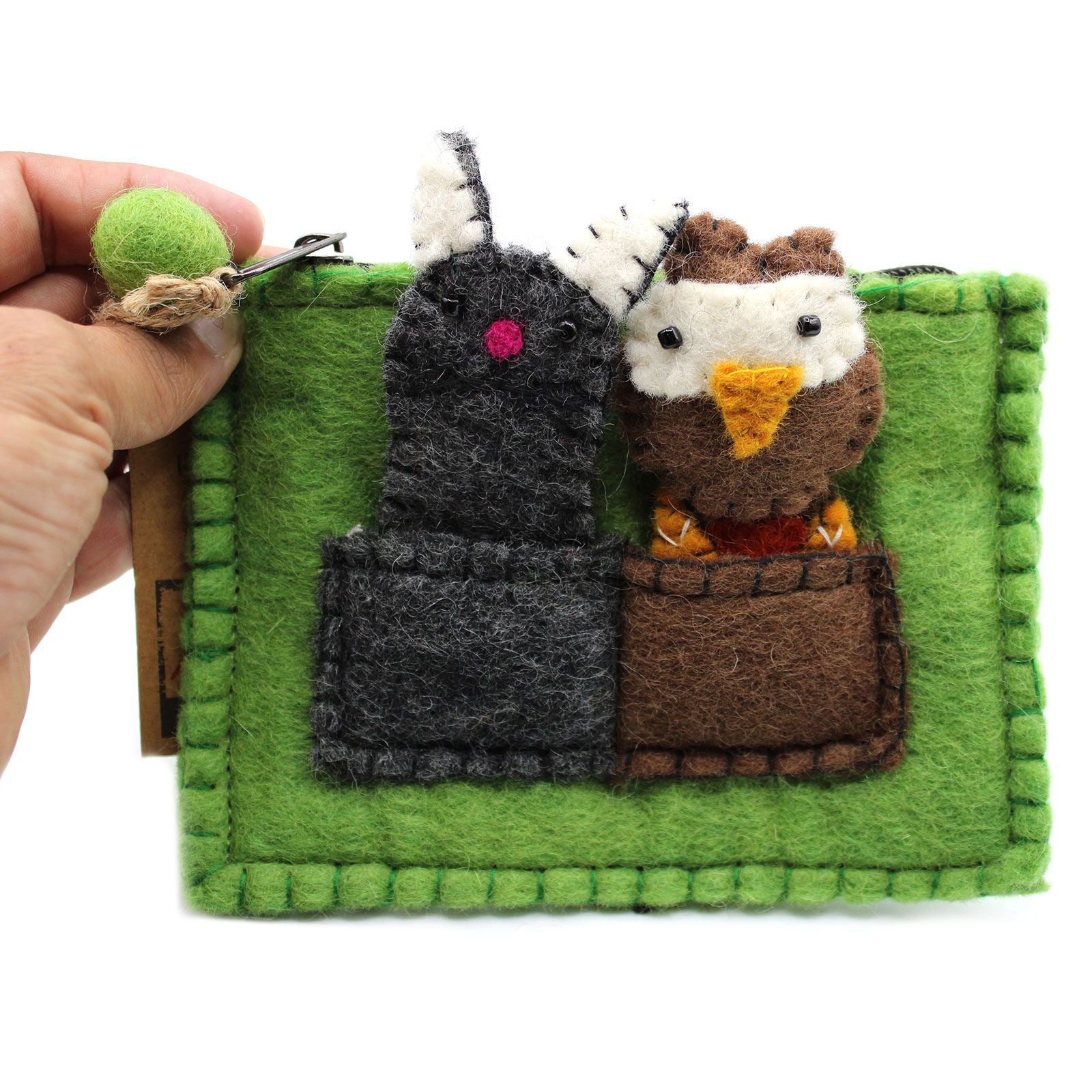 Colourful fabric pouch containing adorable handcrafted owl and pussycat finger puppets.