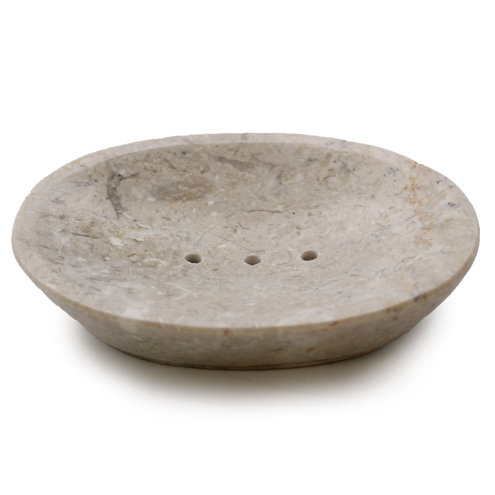 Handmade oval soap dish crafted from smooth cream marble with natural stone veining and drainage holes.