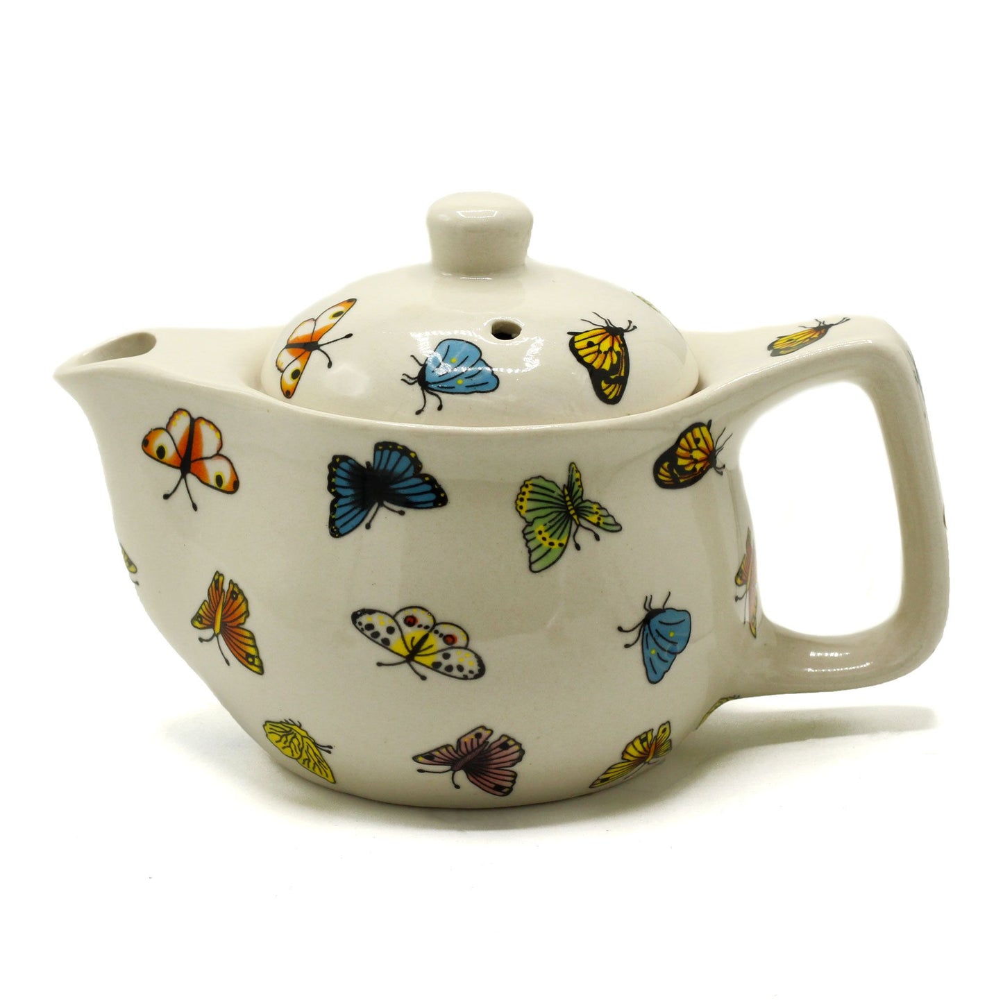 Petite white ceramic teapot featuring a delicate colourful butterfly pattern and a sturdy metal handle.