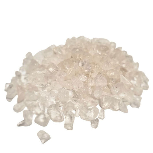 Pile of small, translucent clear quartz gemstone chips with a polished finish.