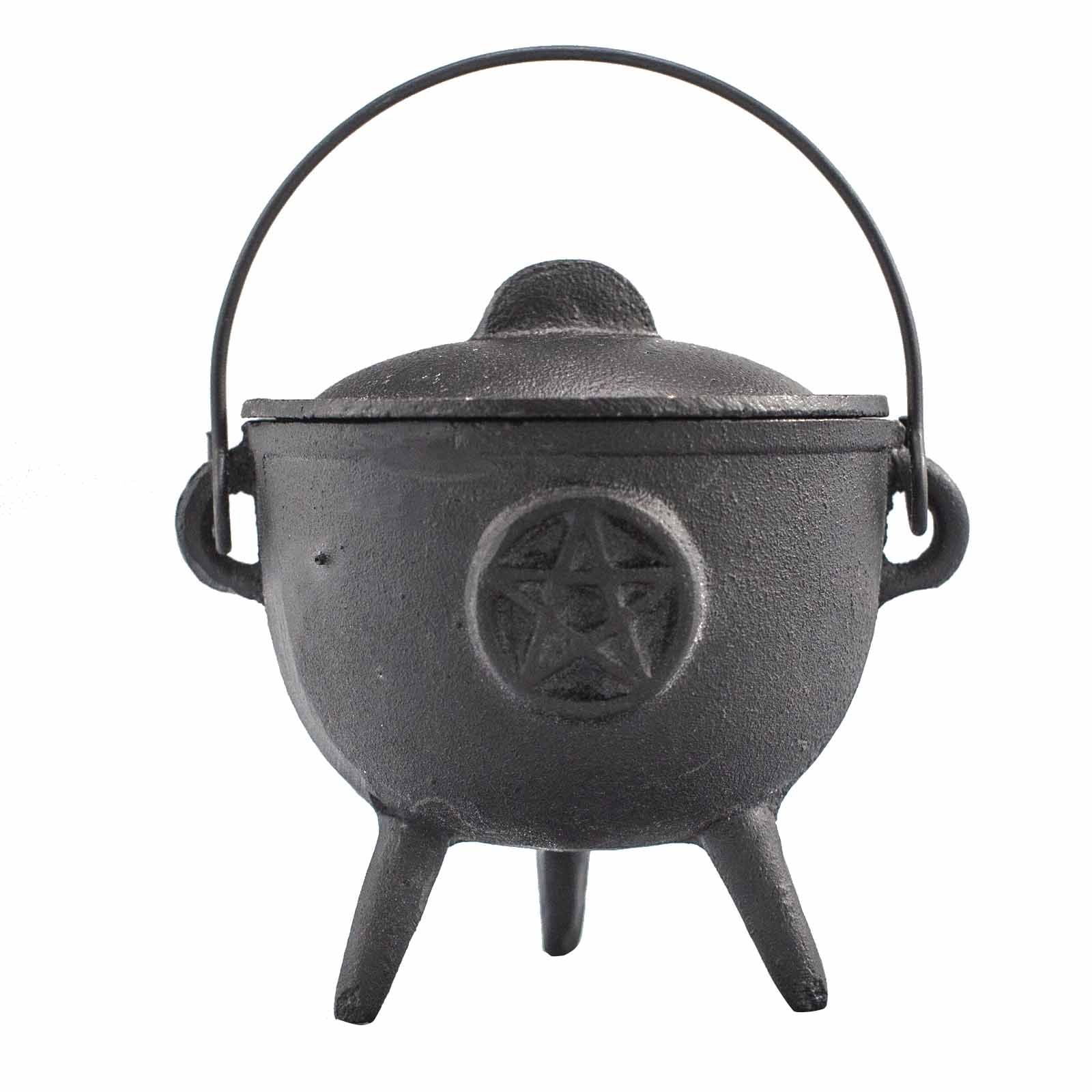 Sturdy black cast iron cauldron featuring a raised pentagram symbol on three legs with a swinging metal handle.