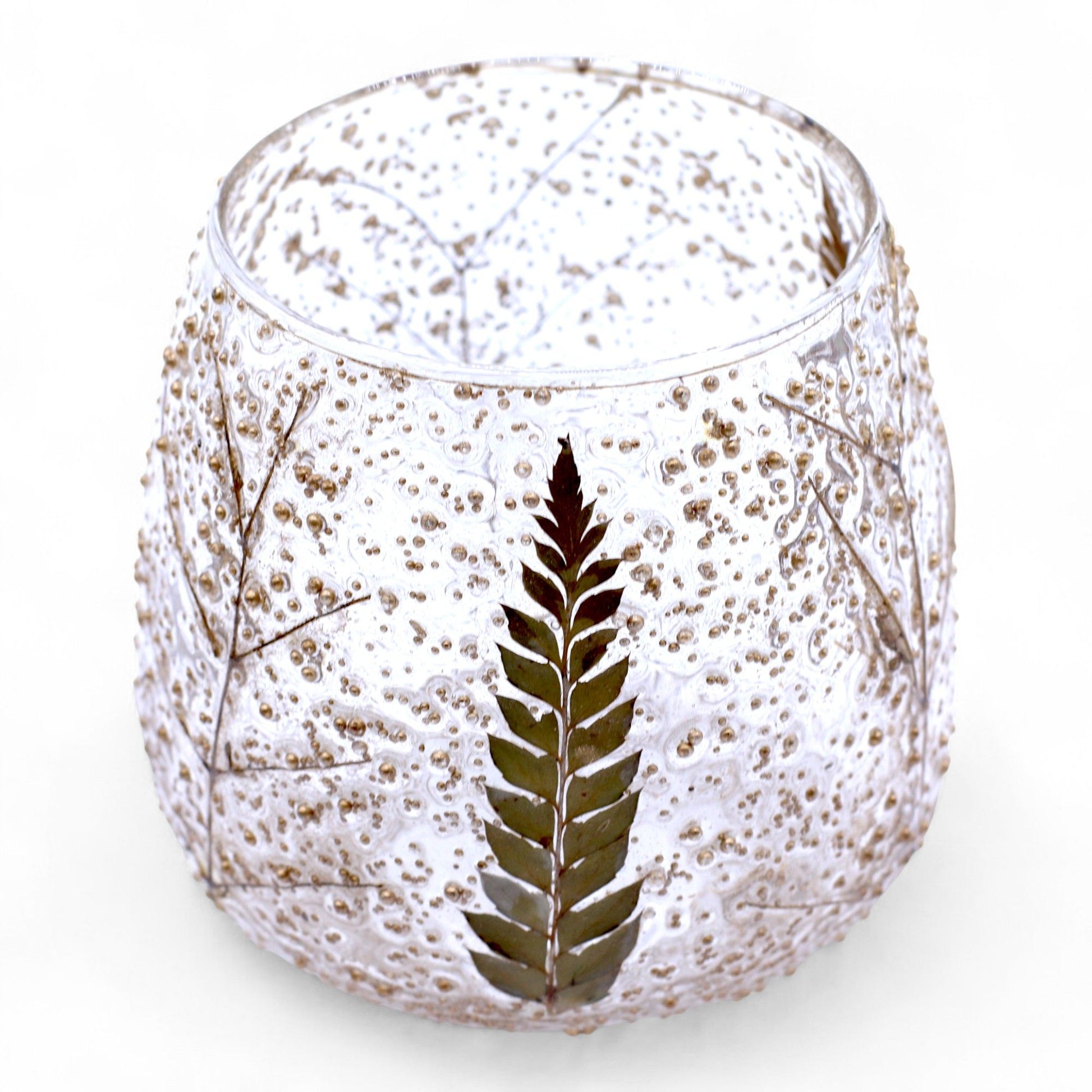 Straight glass candle holder with real preserved green fern leaves encased in textured clear glass.