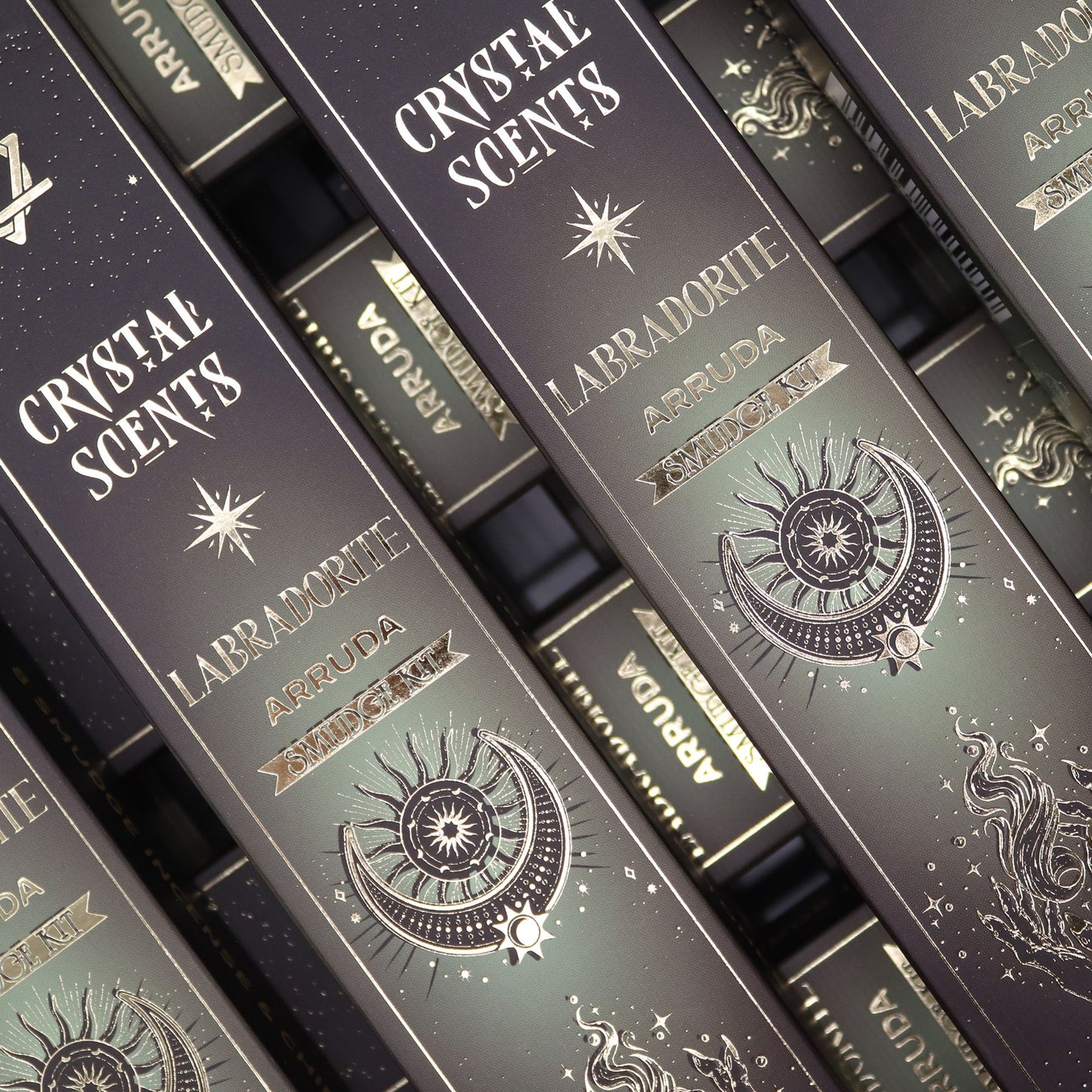 Handcrafted smudge-style incense sticks infused with blue-grey labradorite crystal chipstones in a decorative box.