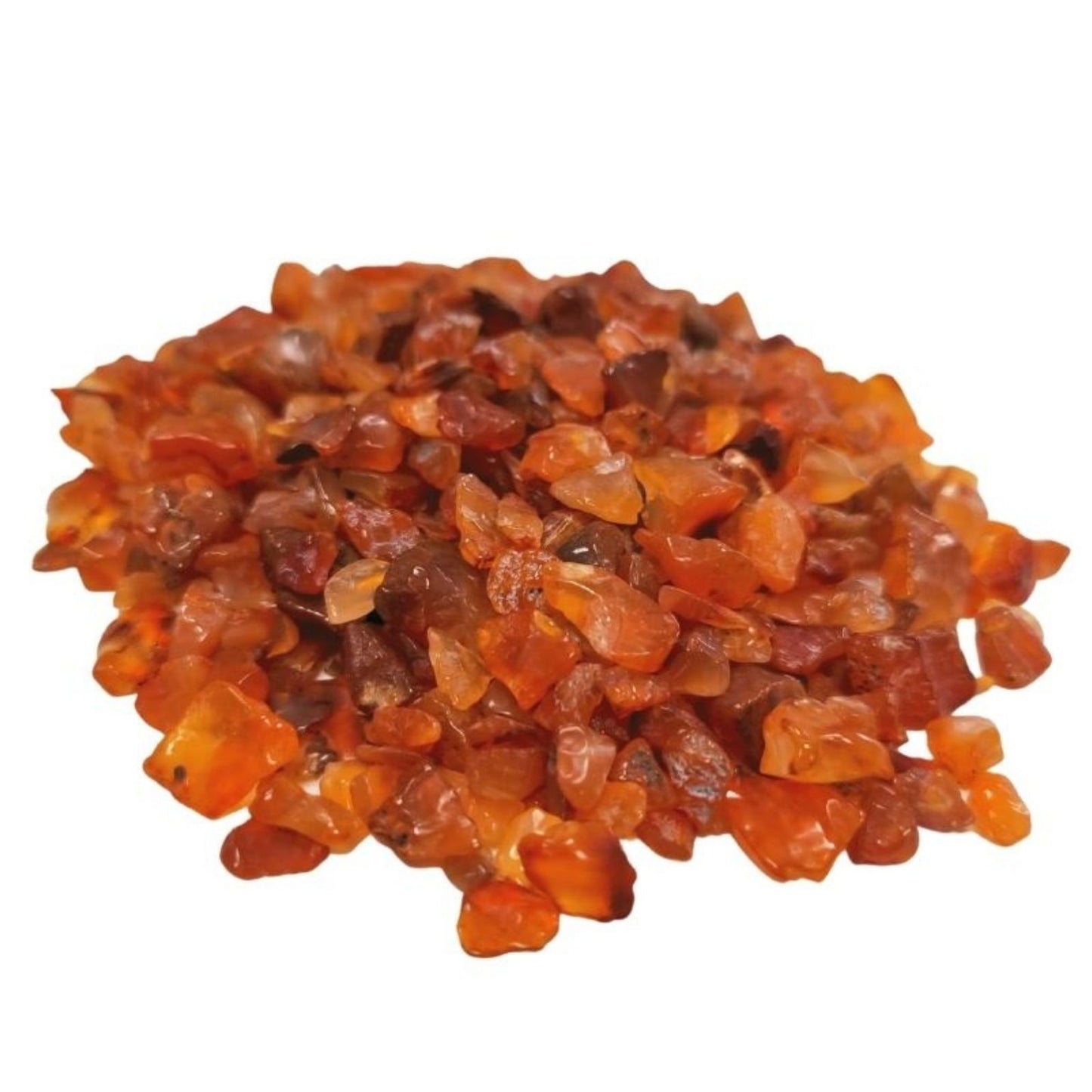 A large pile of small, polished Carnelian gemstone chips showing various shades of translucent orange and red.