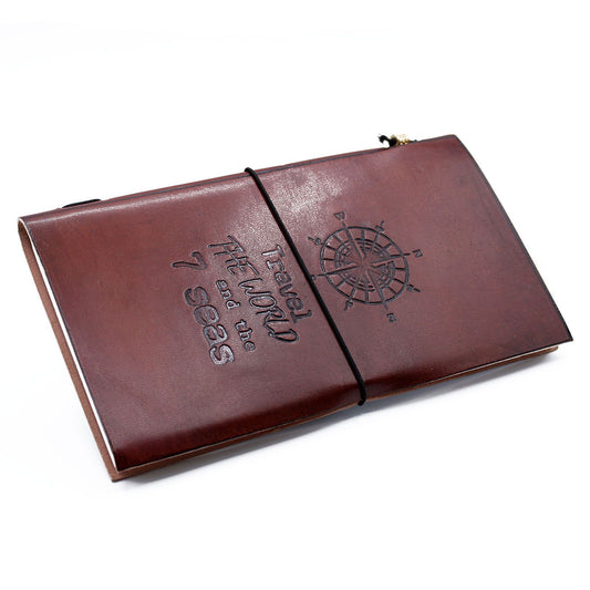 Handmade brown leather journal with embossed travel the world design and a wrap around leather tie closure.