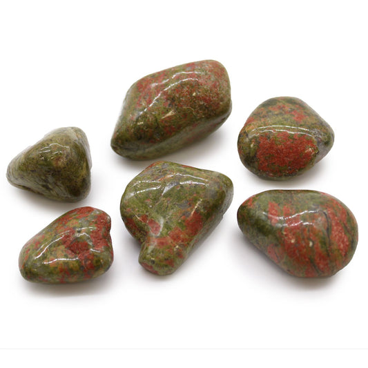 Smooth, large tumbled Unakite stones showing a distinctive mottled pattern of mossy green and salmon pink.