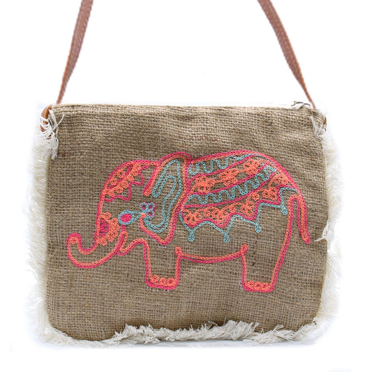 Bohemian style soft washed jute bag featuring detailed elephant embroidery and a stylish cotton fringe.