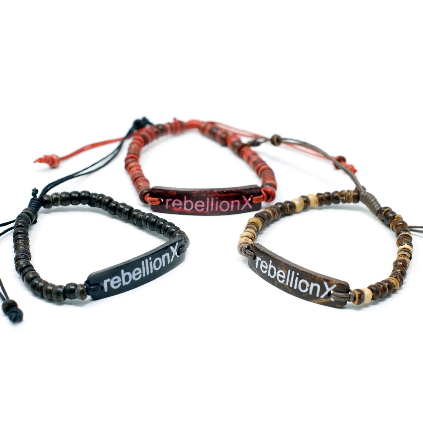 Handcrafted coco beaded stretch bracelet featuring a unique slogan bead on a natural dark wood background.