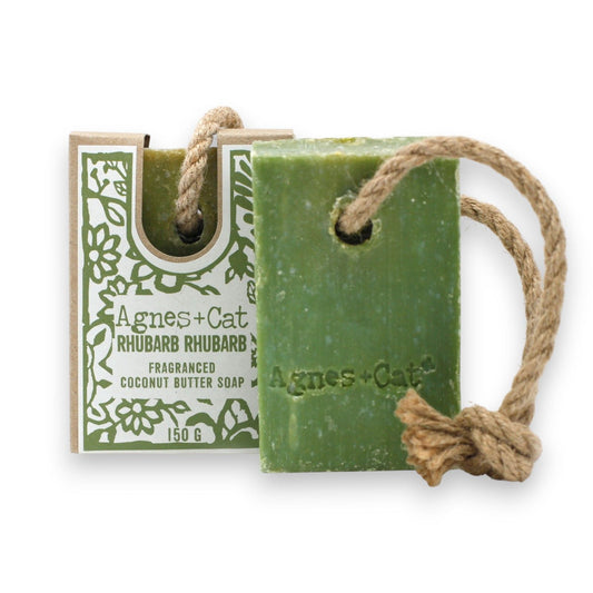A chunky bar of pink and red marbled soap attached to a natural rope loop for hanging in a shower.