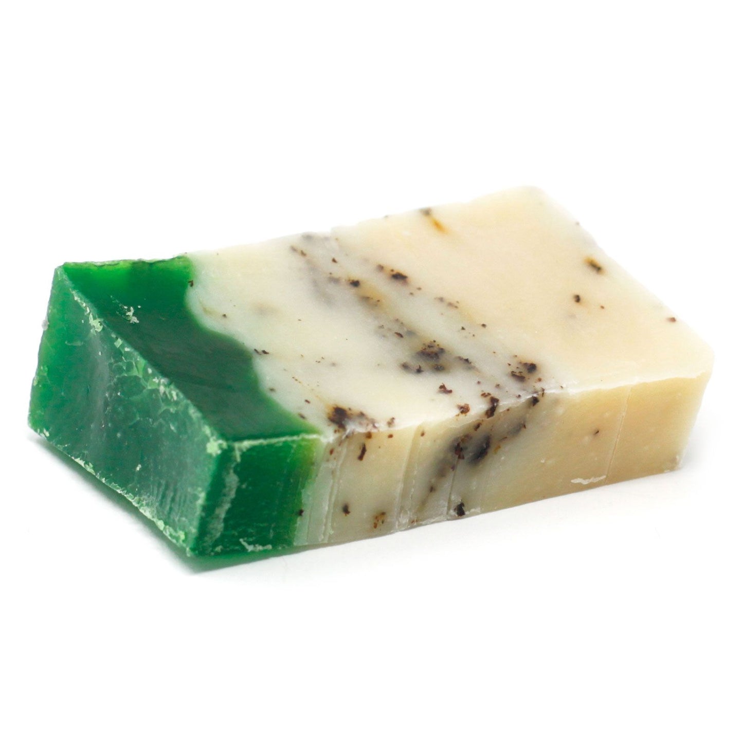 Handmade green tea and olive oil soap slice with visible dried tea leaves for natural exfoliation.