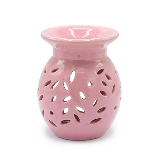 Elegant white ceramic oil burner with a delicate rose floral cutout design and a deep bowl for essential oils.