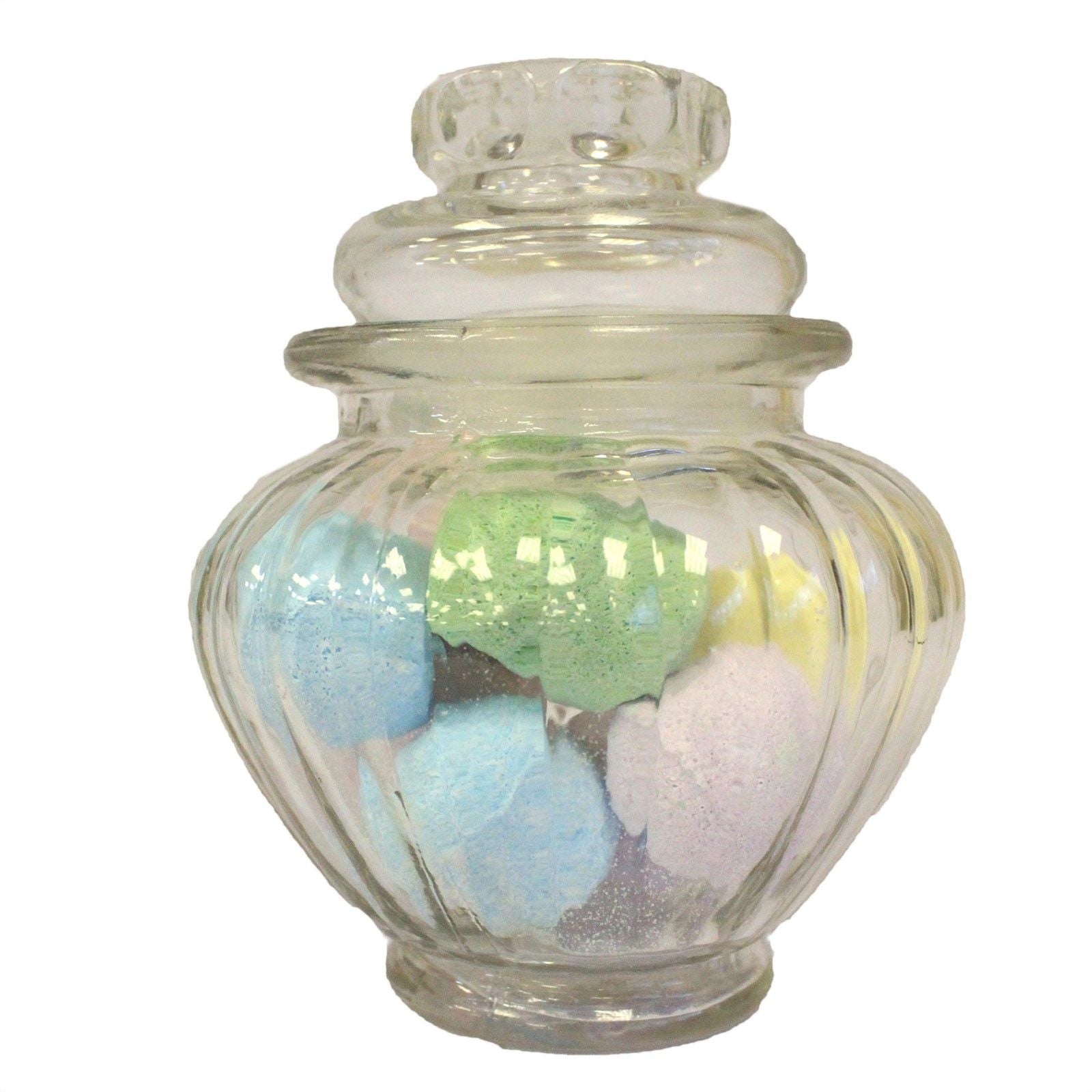 Clear glass storage jar with a decorative ribbed pumpkin shape and a matching glass lid.