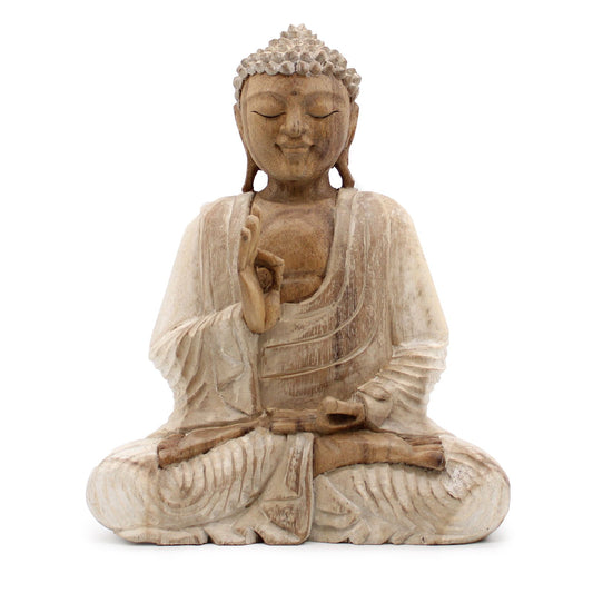 Hand-carved wooden Buddha statue with a distressed whitewash finish, depicting the teaching transmission mudra.