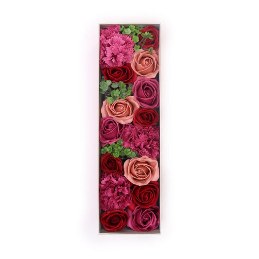 Elegant long gift box filled with realistic pink soap roses arranged in a decorative row.