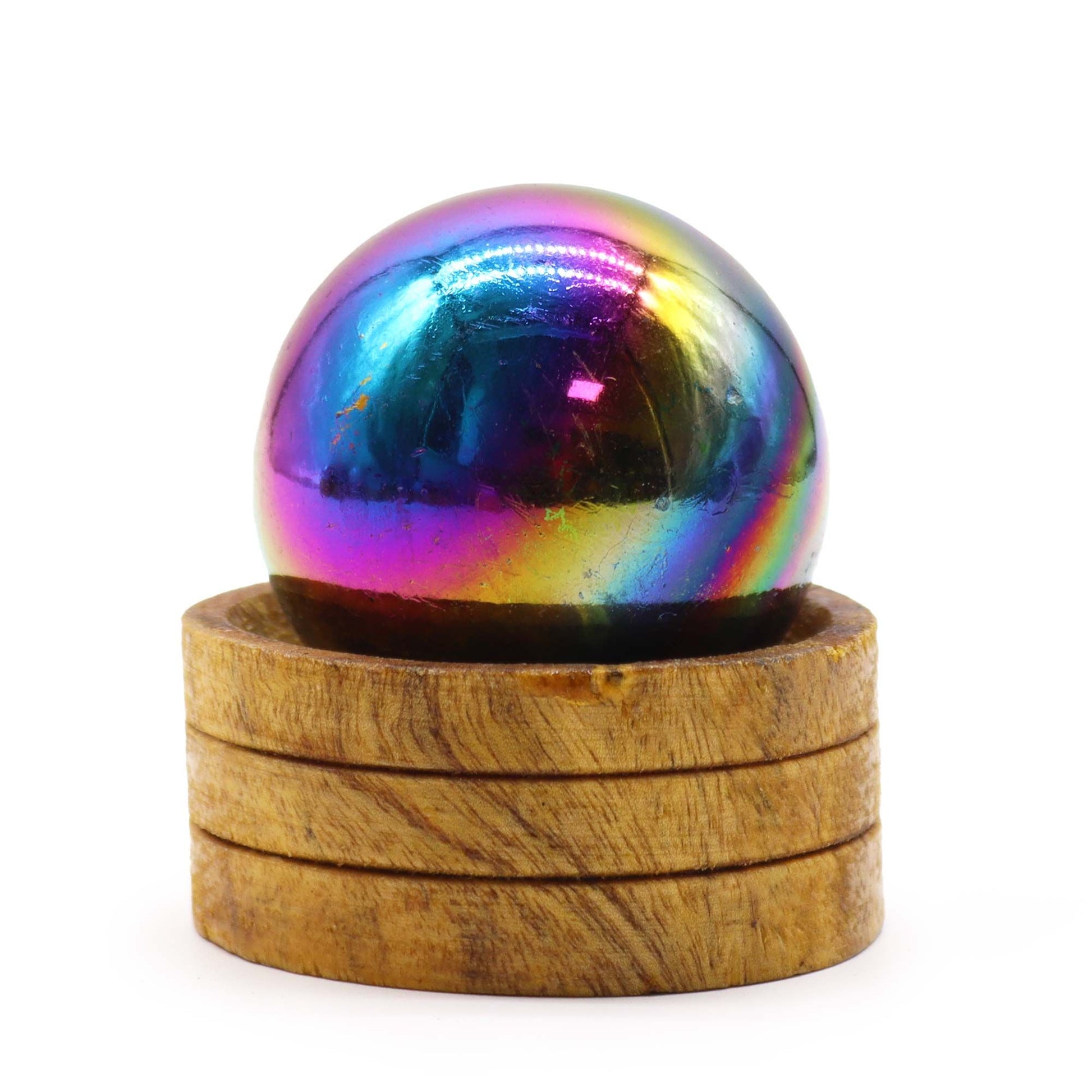 Iridescent purple Amethyst Aura crystal sphere resting on a simple display stand.