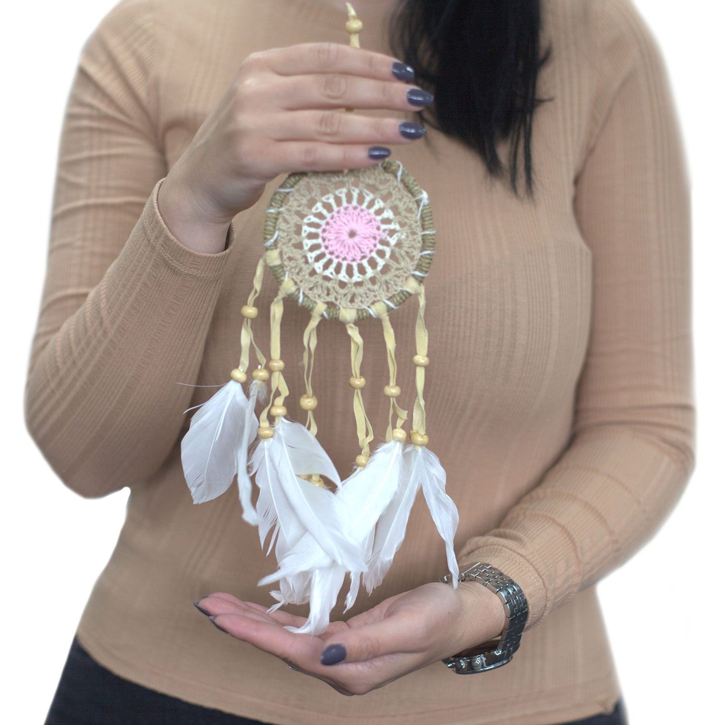 Small 9cm pastel blue macramé dream catcher with an intricate woven web and delicate hanging tassels.