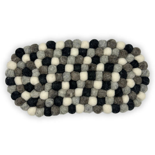 Handmade oval centre mat made from small felted wool balls in various shades of grey and charcoal.