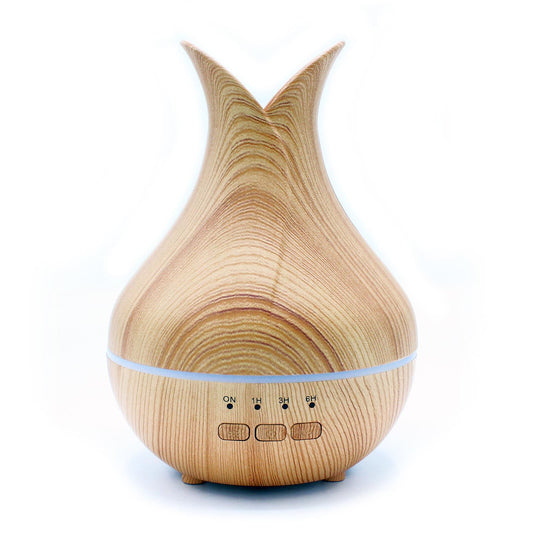 Compact white ultrasonic aroma atomiser with a sleek cylindrical design and subtle LED light ring.