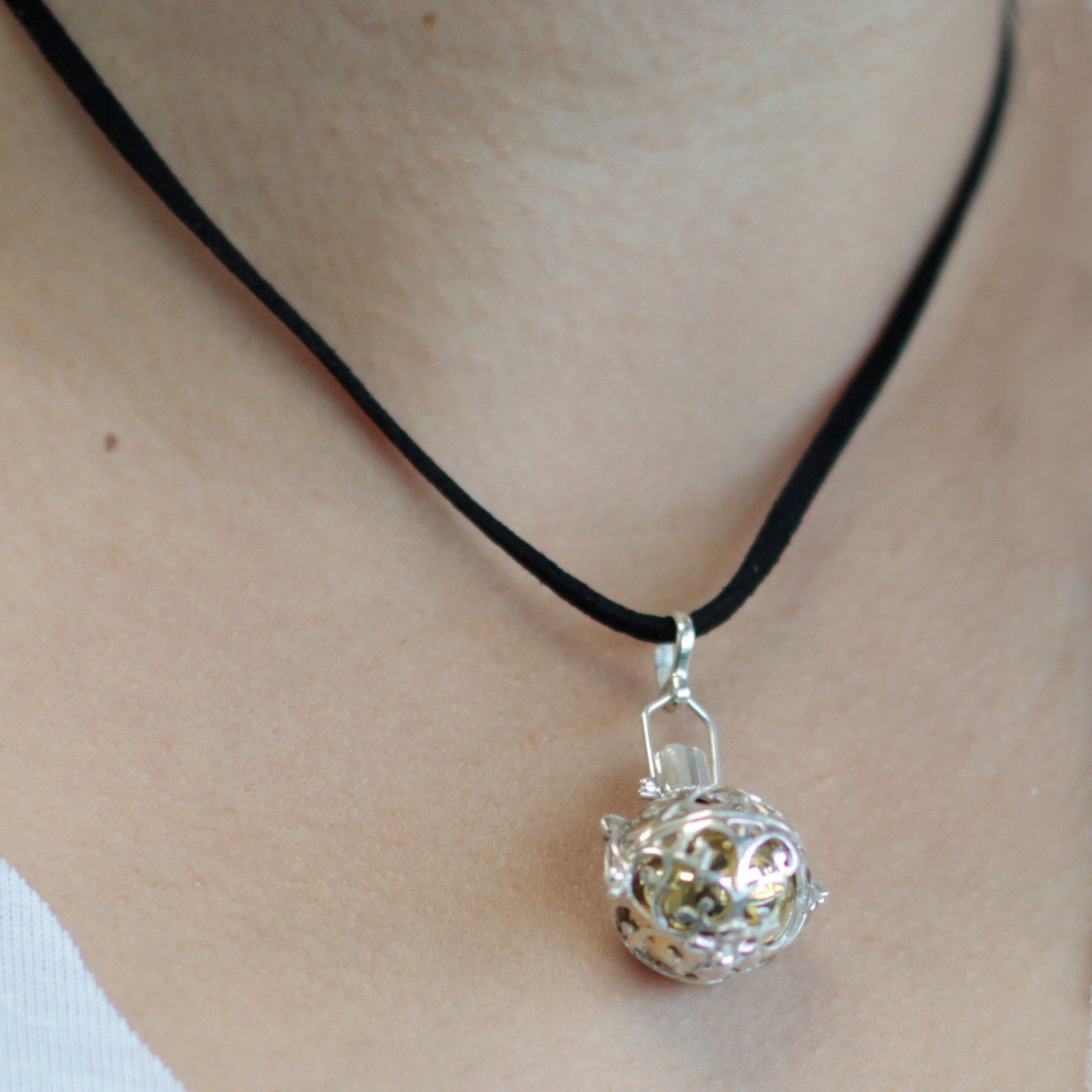 Delicate 18mm 925 sterling silver angel bell pendant with intricate night-time celestial engravings.