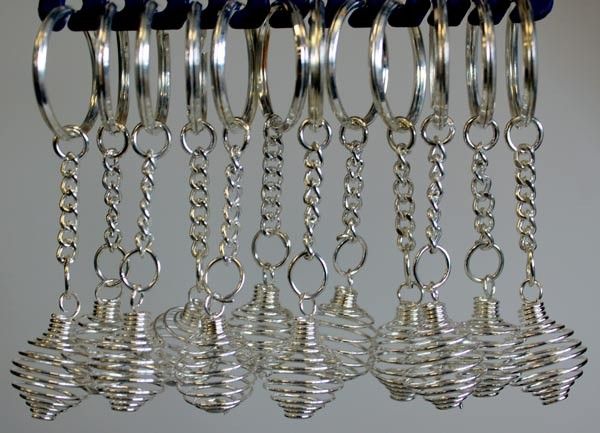 Twelve silver-tone metal spiral cage key-rings designed to hold small gemstones or tumbled crystals.