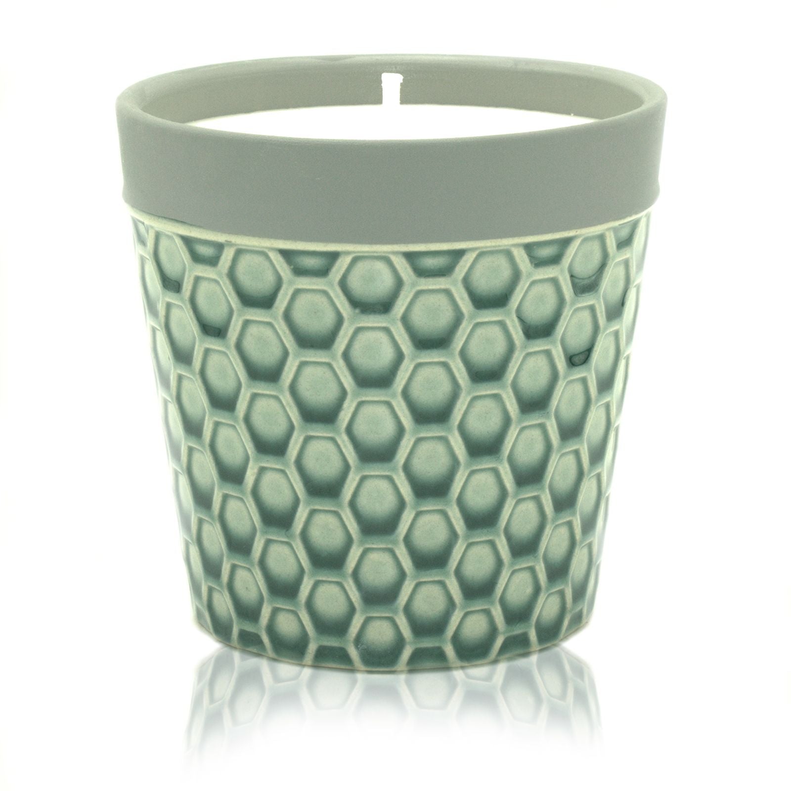 Large rustic ceramic candle pot filled with white soy wax and a single wick.