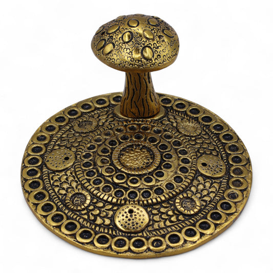 Detailed brass-effect aluminium incense plate featuring an embossed mushroom design and central stem for holding sticks.