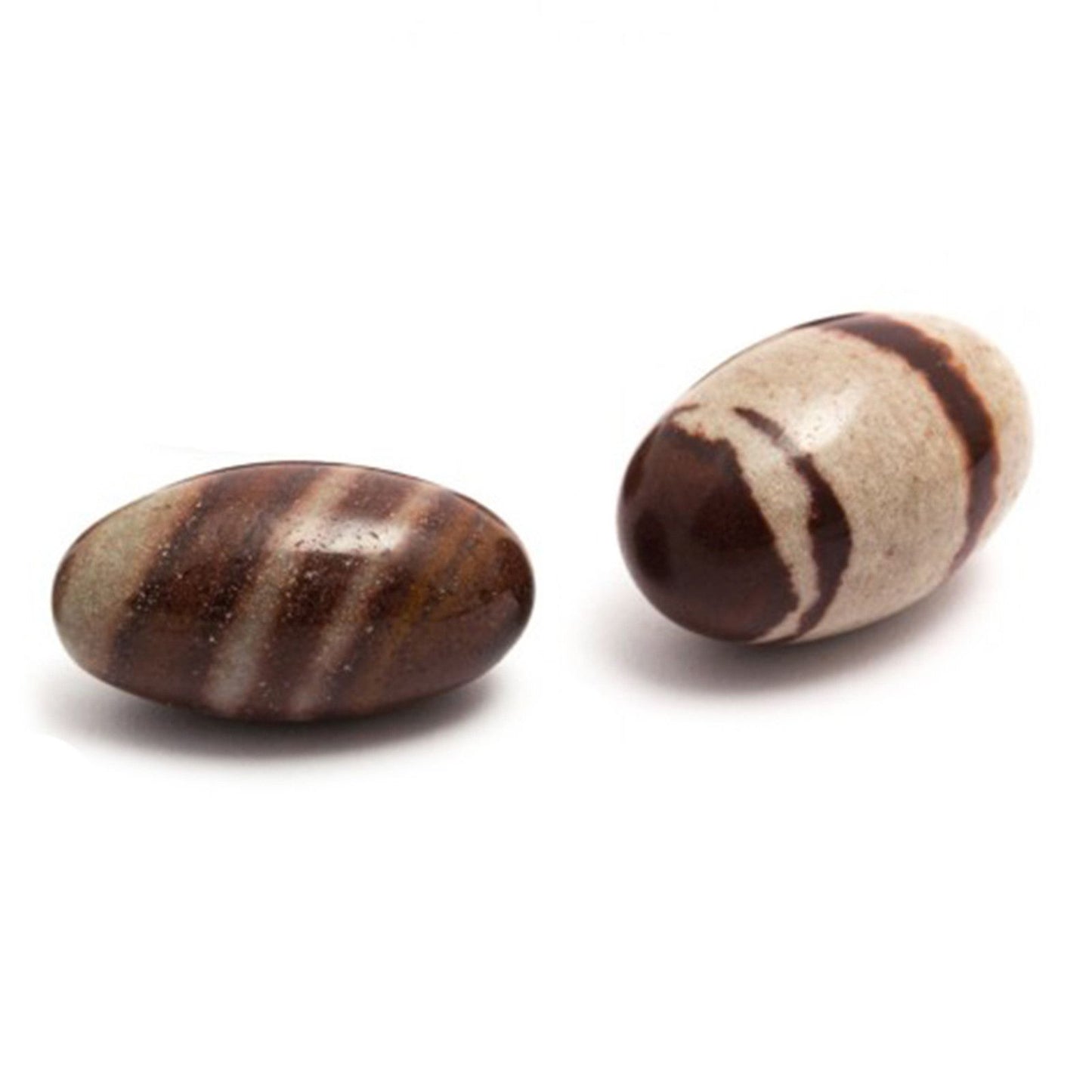 Two smooth, egg-shaped Shiva Lingam stones with natural brown and tan marbled patterns.