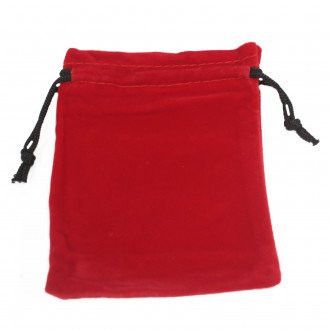 Small red velvet drawstring bag with a luxurious texture and contrasting black cord on a plain background.