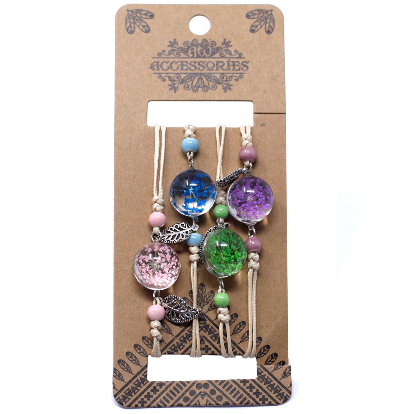 Delicate bracelet featuring real pressed flowers and green leaves encased in a small circular glass charm.