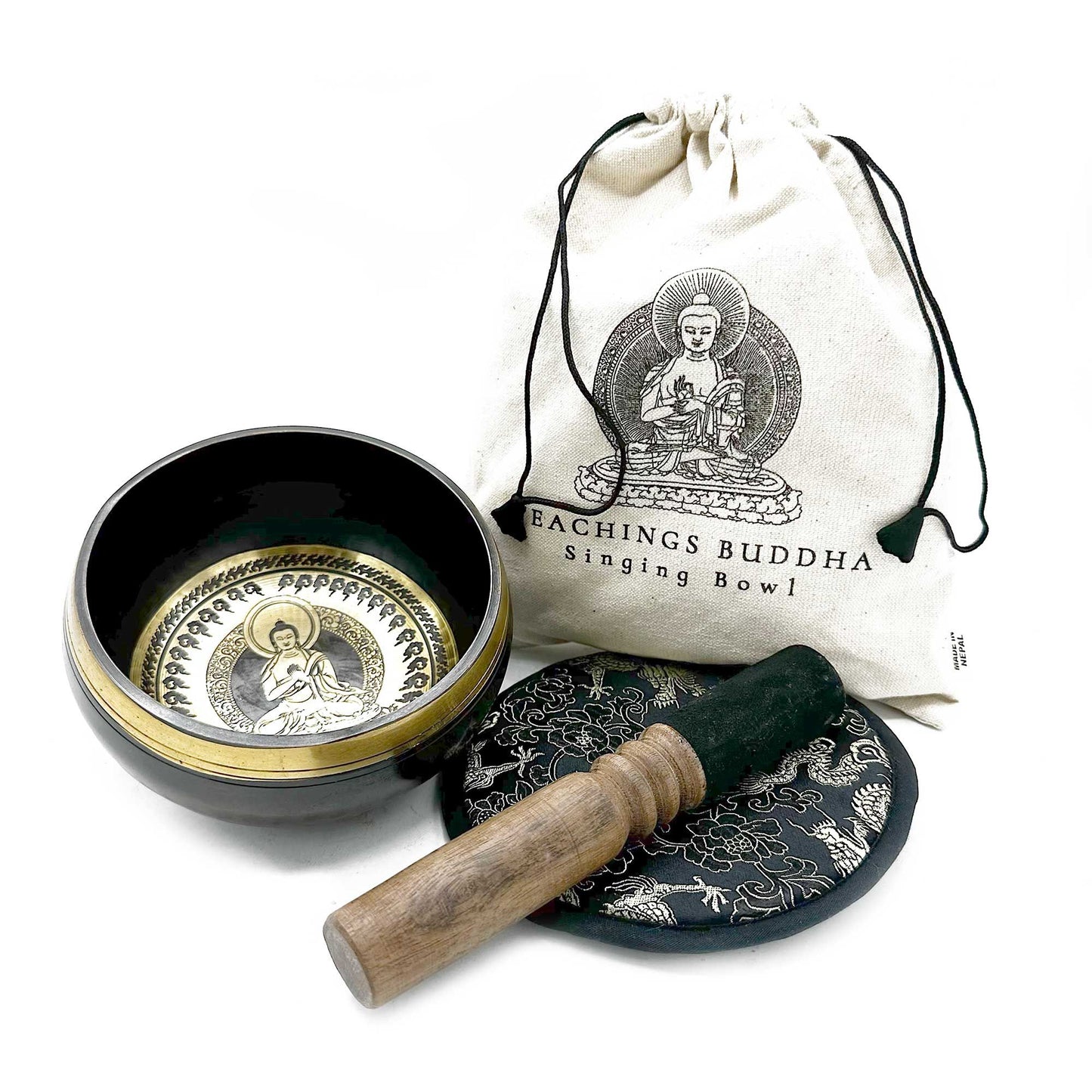 Handcrafted 14cm bronze singing bowl with intricate Buddha teaching engravings, wooden mallet, and patterned cushion.