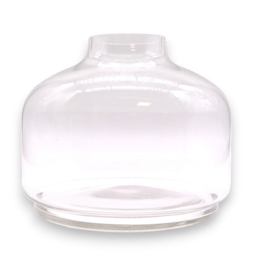 Extra large clear glass ball top terrarium resting on a circular dark tung wood base.