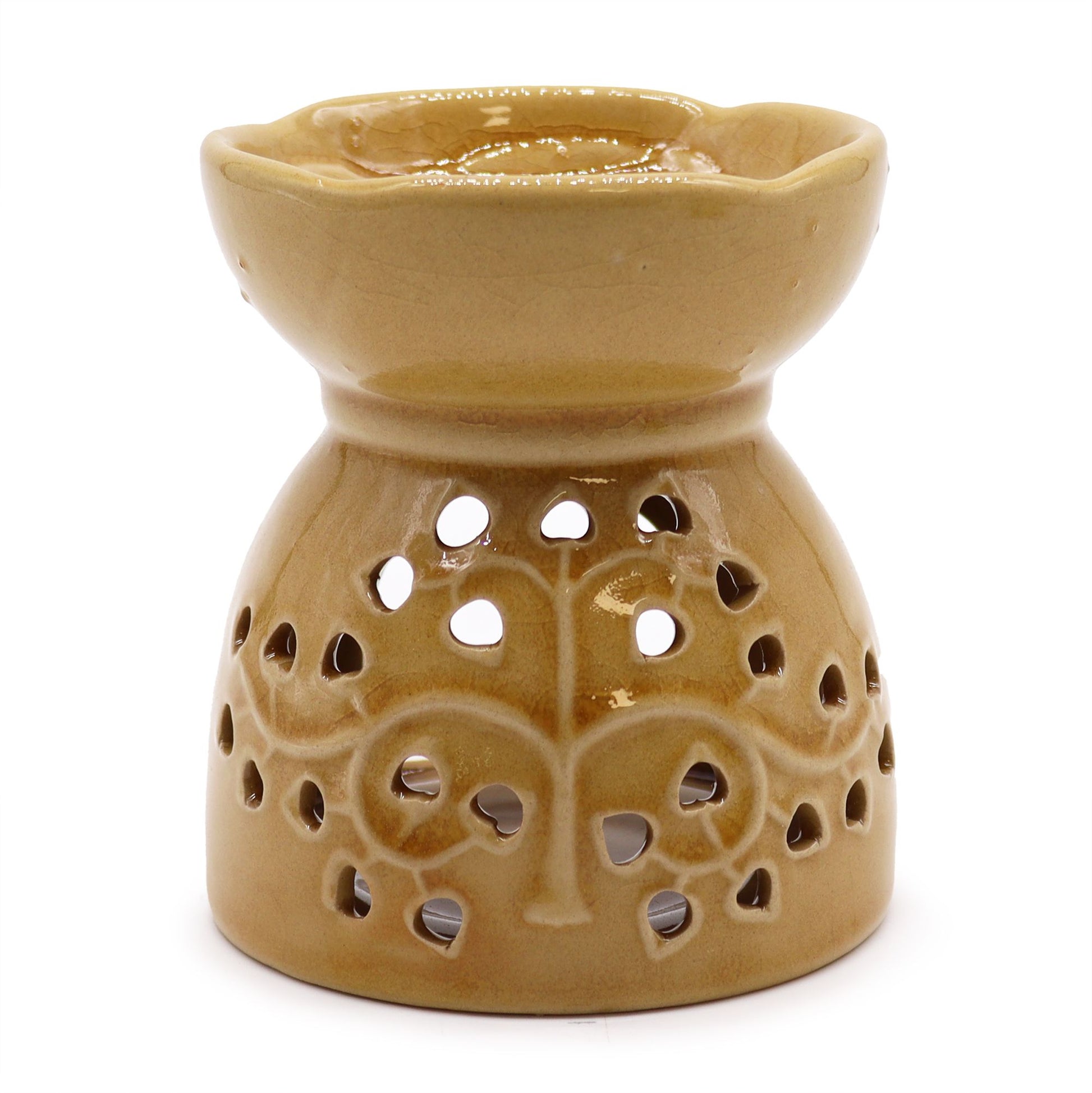 Ceramic oil burner with a warm honey glaze featuring a decorative Tree of Life cutout design.