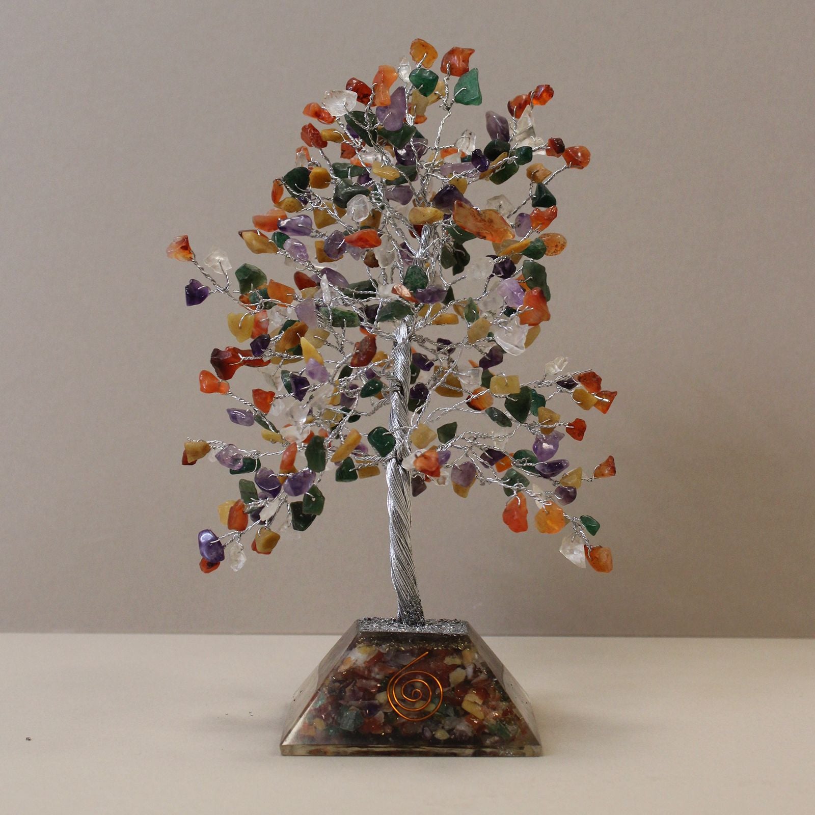 Large gemstone tree with colourful multi-stone branches and a copper-infused orgonite pyramid base.