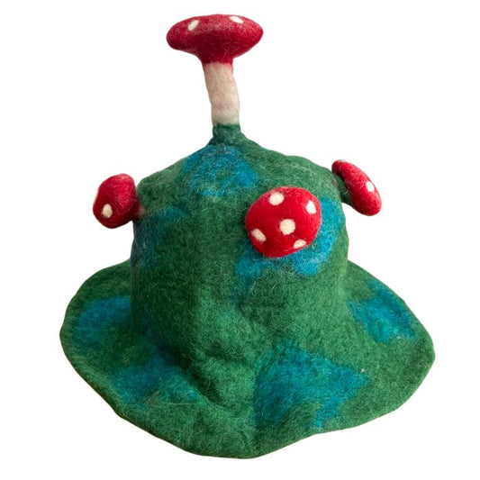 Handcrafted felted mushroom hat in a deep mossy mountain green with a classic whimsical fungal shape.