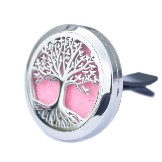 Stainless steel round car vent locket with an intricate Tree of Life cut-out design and a colourful felt pad inside.