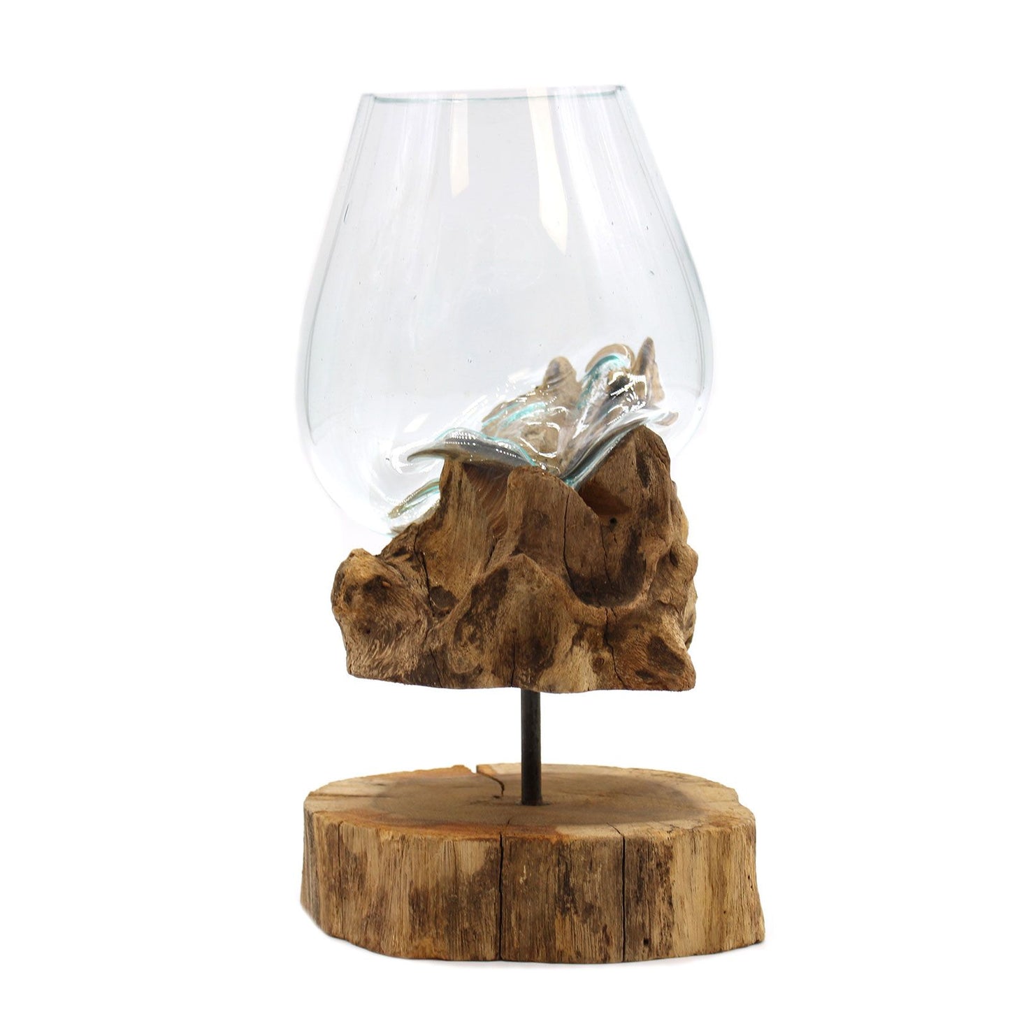 Large hand-blown molten glass bowl slumped over a natural wood root base on a minimalist metal stand.
