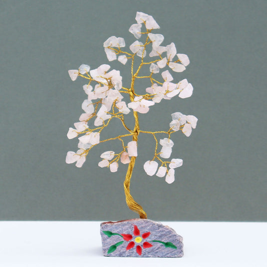 Handmade Rose Quartz crystal tree with 80 pink gemstone leaves and wire branches on a natural stone base.