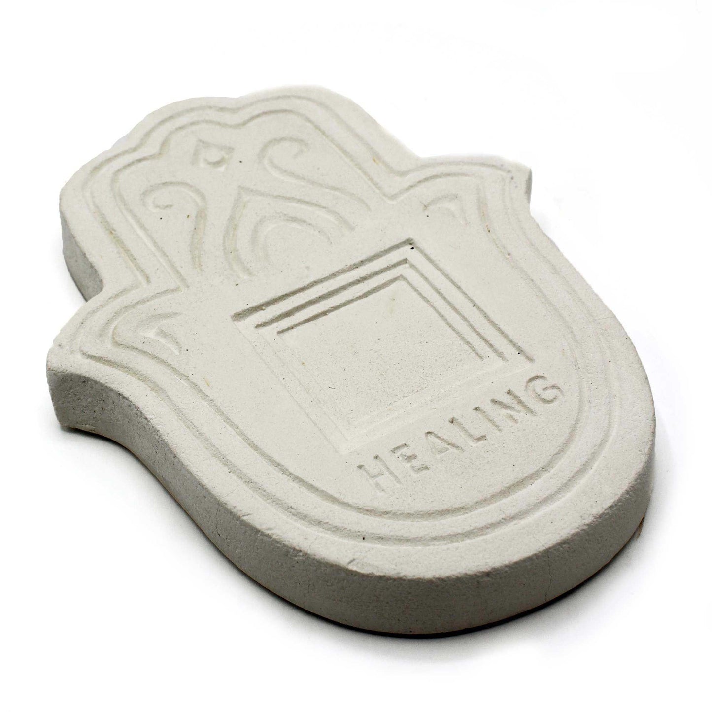 Round white stone effect incense holder plate with a textured finish and central hole for incense sticks.