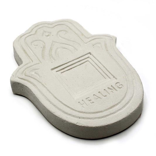 Round white stone effect incense holder plate with a textured finish and central hole for incense sticks.