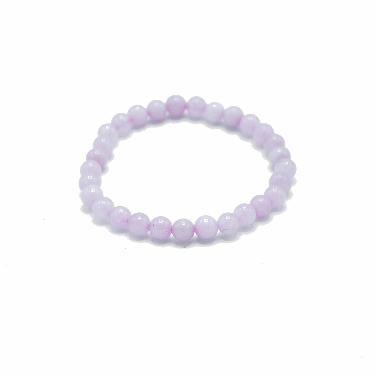 Delicate elasticated bracelet featuring polished pale pink rose quartz gemstone beads.